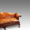 Edwardian camel back leather sofa arm