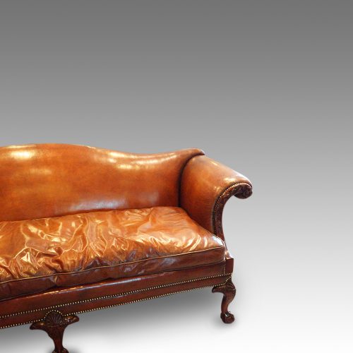 Edwardian camel back leather sofa arm