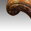 Edwardian camel back leather sofa arm carving