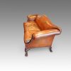 Edwardian camel back leather sofa end