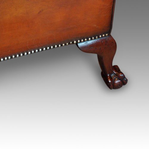 Edwardian camel back leather sofa rear leg