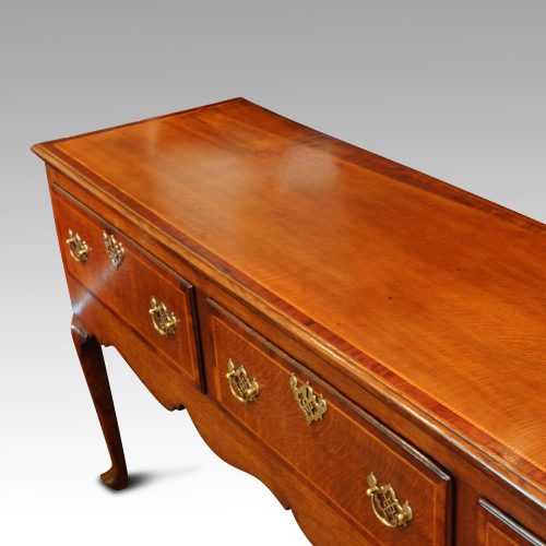 Antique oak dresser base at angle