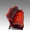 Victorian red leather club sofa side view