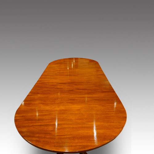 Antique mahogany twin pillar dining table end detail