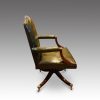 Leather revolving desk chair side