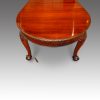 Edwardian mahogany 3 leaf extending dining table end view