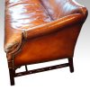 Edwardian mahogany camel back sofa end detail