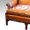 Edwardian mahogany camel back sofa studded panel
