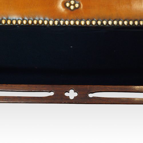 Edwardian mahogany camel back sofa under stretcher