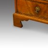 George III walnut bureau bracket feet