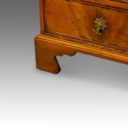 George III walnut bureau bracket feet