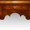 George V walnut double dome bookcase shaped apron