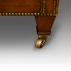 Edwardian pair of easy chairs front leg