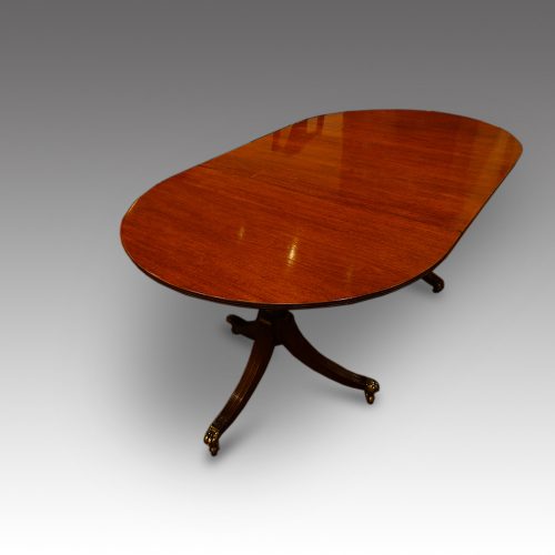 Regency style mahogany dining table end view