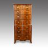 Walnut serpentine tallboy