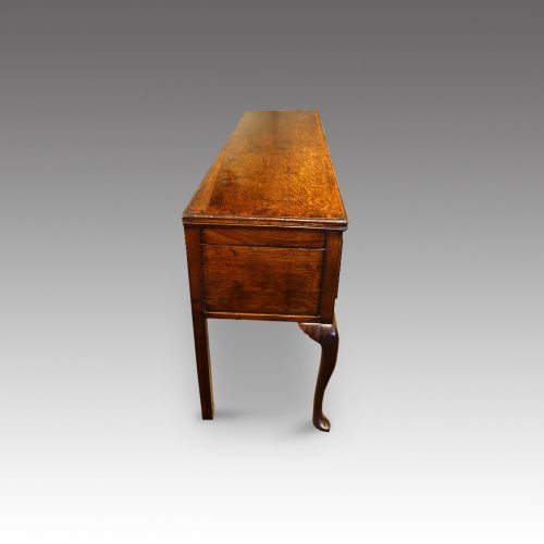 Antique oak cabriole leg dresser base from end