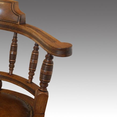 Victorian oak revolving desk chair arm
