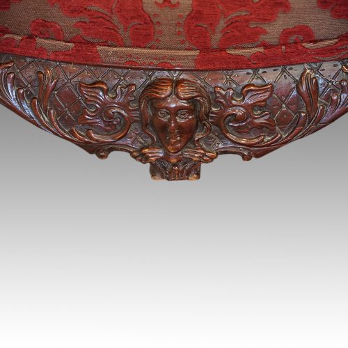 Pair of Georgian style wing chairs crest