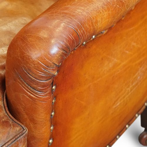 Pair of Victorian leather club chairs arm rest