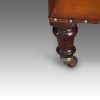 Pair of Victorian leather club chairs front leg