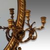 Antique gilt oval mirror sconces detail