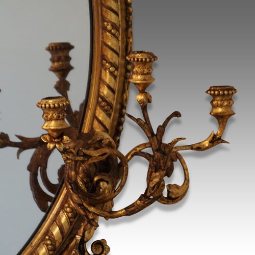 Antique gilt oval mirror sconces detail
