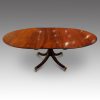 Oval mahogany extending dining table