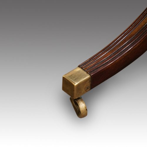 Oval mahogany extending dining table brass square toe