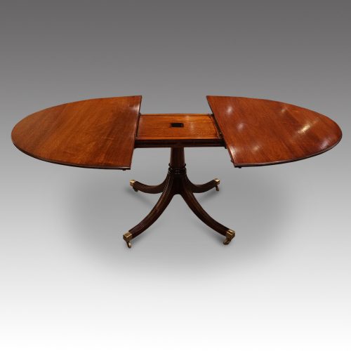 Oval mahogany extending dining table leaf out