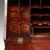 Queen Anne walnut bureau bookcase concave drawers