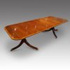 Regency style mahogany twin pillar dining table at angle