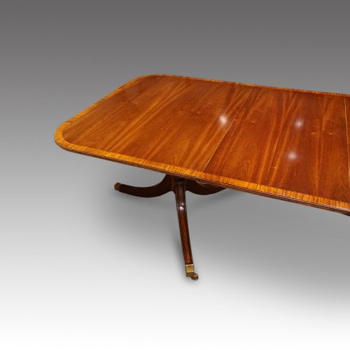 Regency style mahogany twin pillar dining table end detail