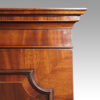 George III mahogany linen press cornice detail