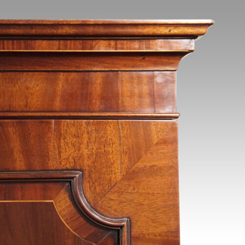 George III mahogany linen press cornice detail