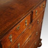 Queen Anne oak and burr elm chest of drawers at angle