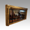 Regency gilt over mantle mirror at angle