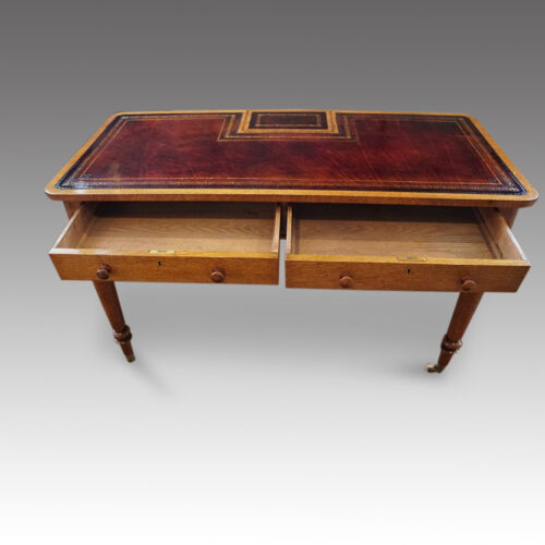 Victorian oak writing table drawers open