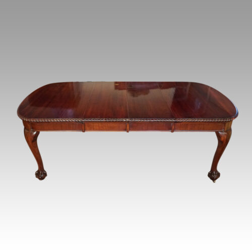 Edwardian mahogany claw and ball extending table