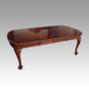 Edwardian mahogany claw and ball extending table at angle