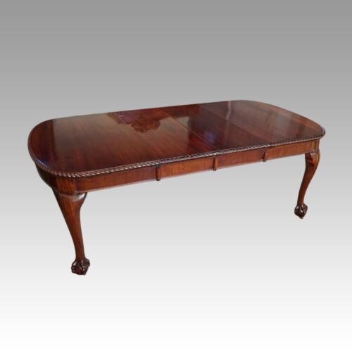 Edwardian mahogany claw and ball extending table at angle