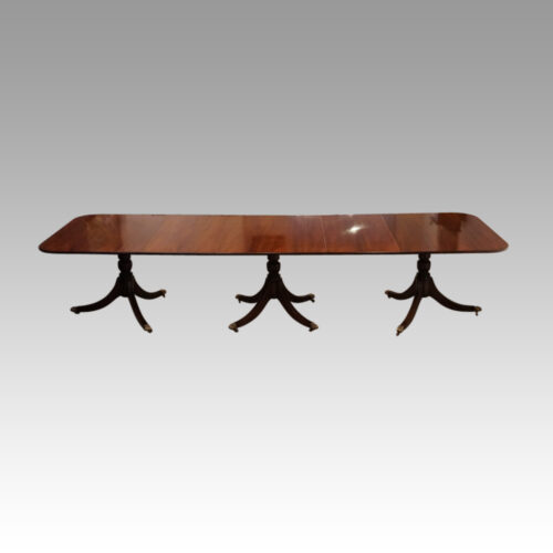Regency style mahogany 3 pillar dining table side view