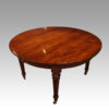 Edwardian mahogany circular extending dining table top view