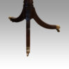 Regency style mahogany twin pillar table castors