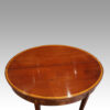 Antique inlaid mahogany demi lune tea table top detail