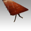 Antique large 3 pillar dining table at angle