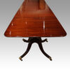 Antique large 3 pillar dining table end view