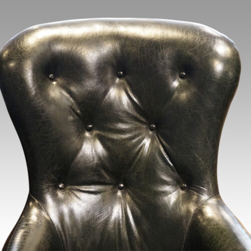 Victorian green leather easy chair button back