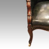 Victorian green leather easy chair front leg