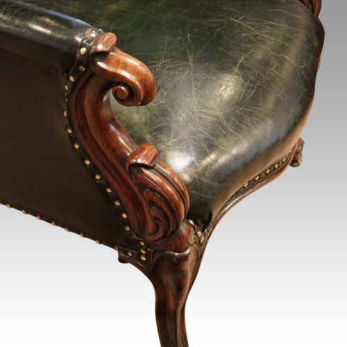 Victorian green leather easy chair shaped arm