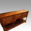 Antique oak dresser base at angle